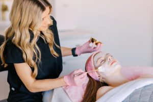 woman receiving spa facial