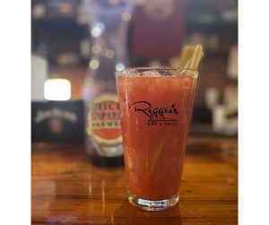 Bloody Mary with celery stalk and Reggie's Downtown logo on the cup