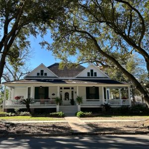 front exterior of Victorian-style home with large front porch
