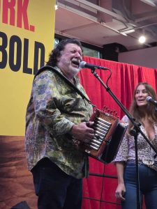 Wayne Toups with his accordion singing on stage
