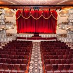 Opera House interior with large red curtain across the stage