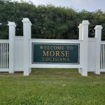 white fence with Welcome to Morse, Louisiana sign