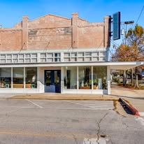 historic brick building with covered storefront