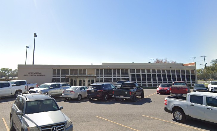 government building in the background, with a parking lot in the foreground