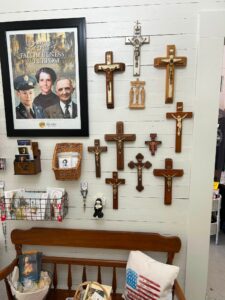 collection of crosses hanging on a wall