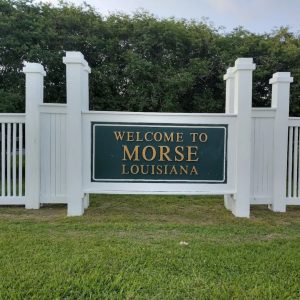 white fence with Welcome to Morse, Louisiana sign